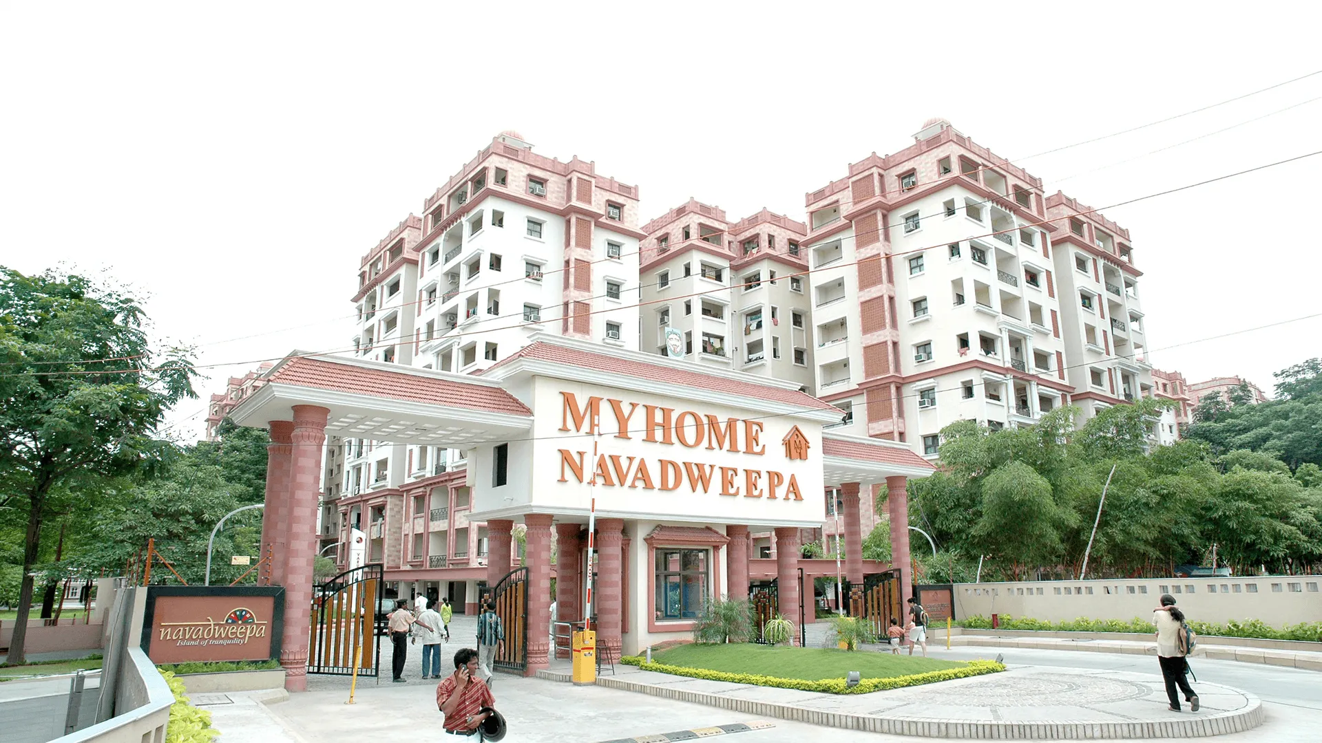 The My Home Navadweepa entrance gate, with the rose-white residential towers behind it